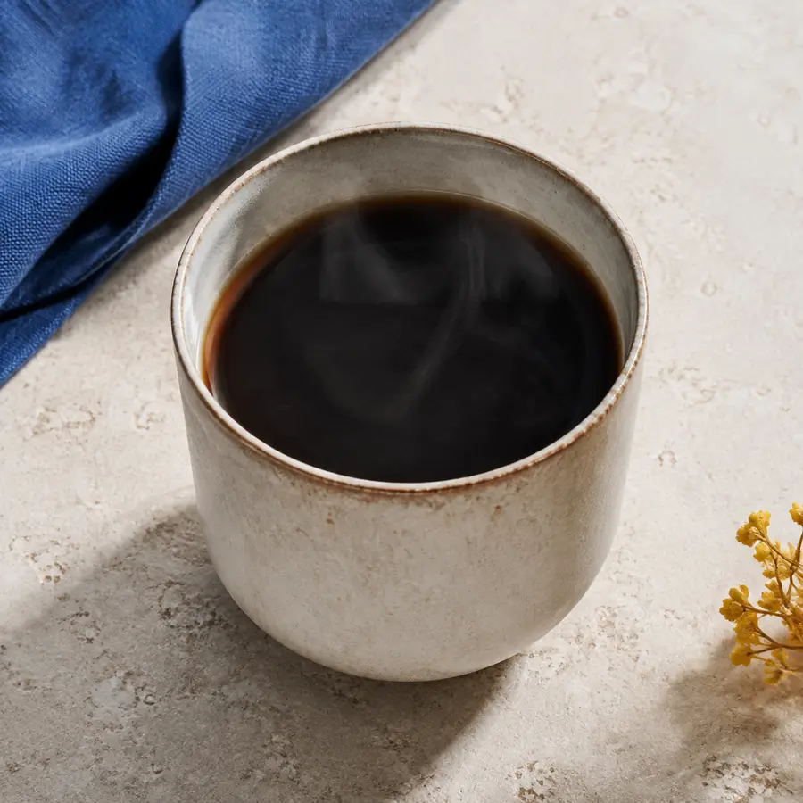 Ceramic cup of The Daily house drip coffee